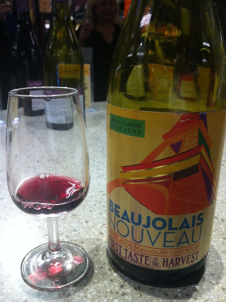 Beaujolais nouveau wine bottle and glass