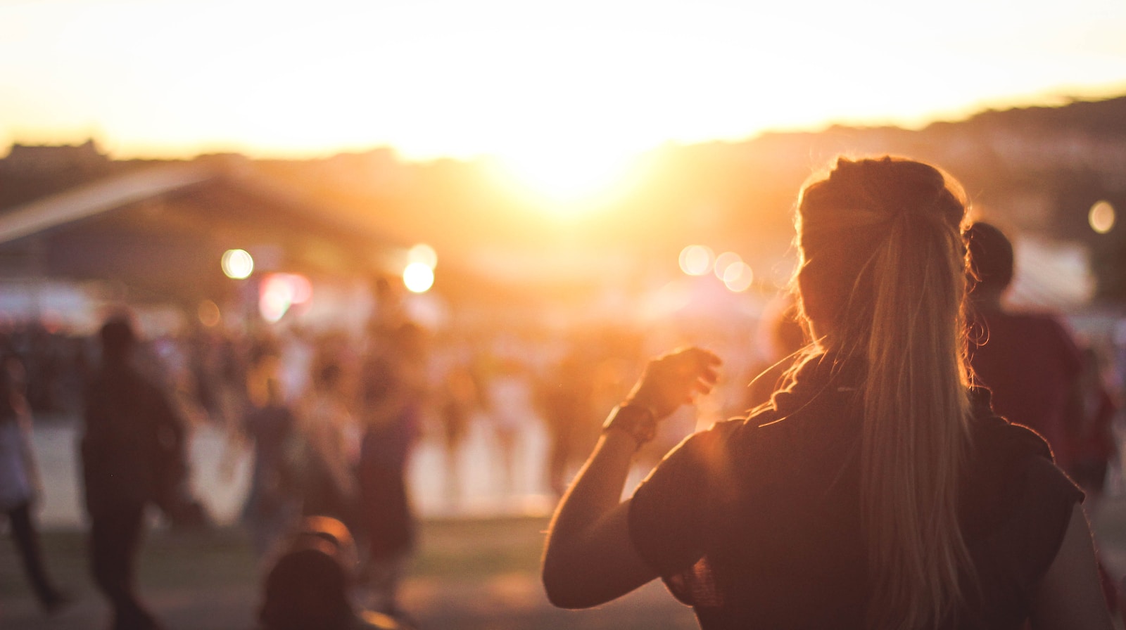 silhouette photo of woman at a wine festival